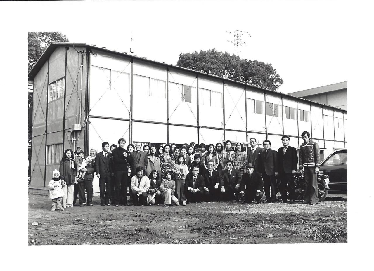 The first group with Government and Church representatives outside the camp.